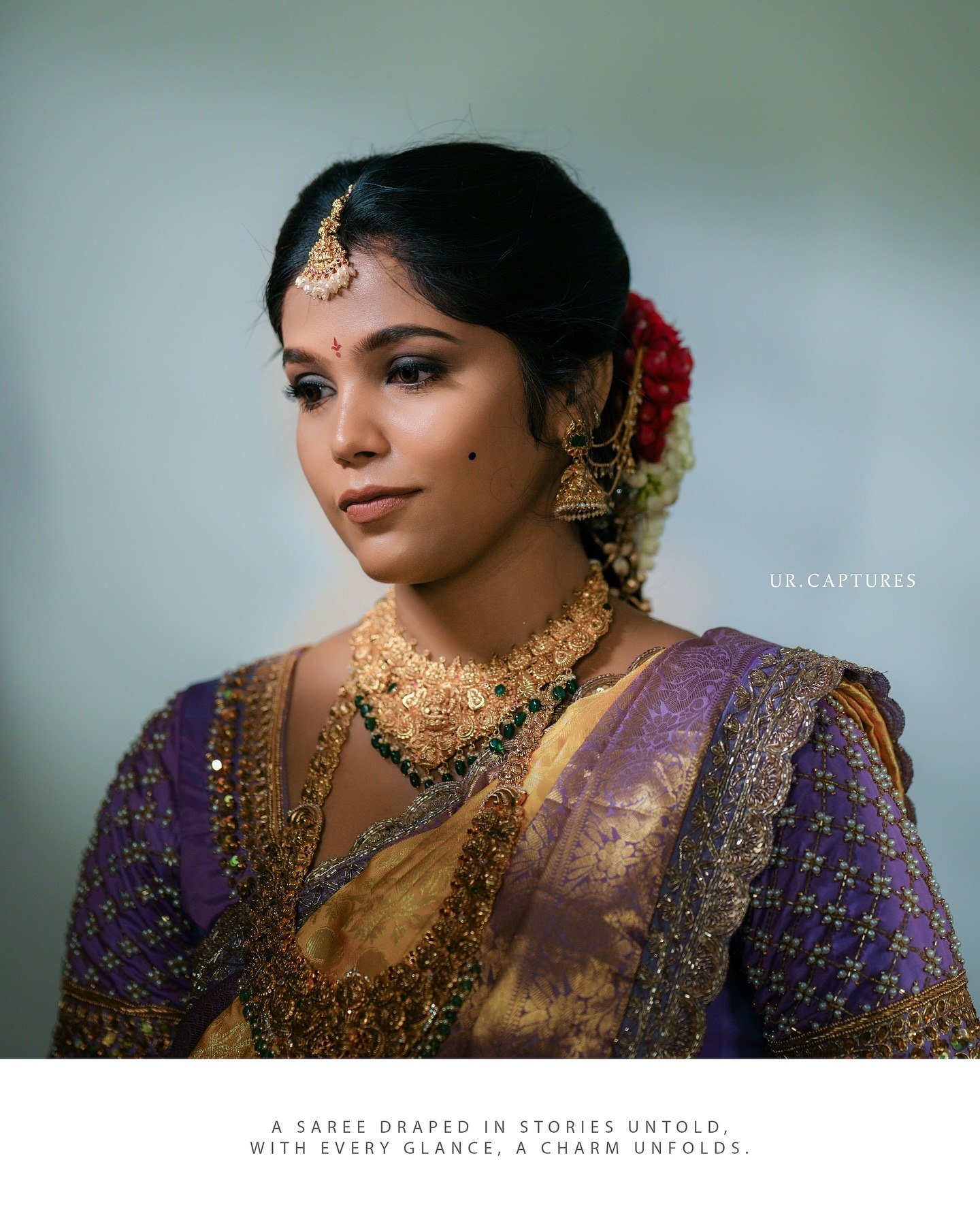 A close-up bridal portrait with traditional jewelry